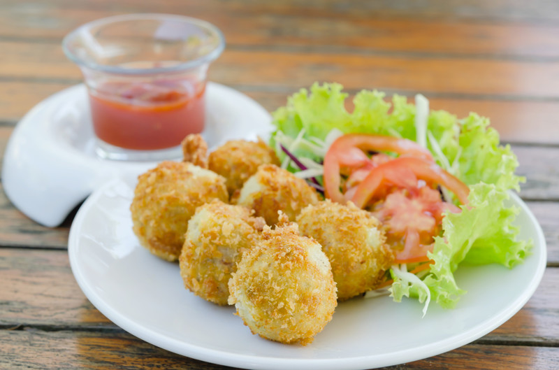Deep Fried Potato Croquettes  served with tomato sauce  and fresh vegetable