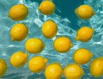 Lemons floating in swimming pool